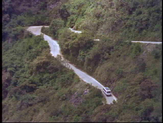 PERU, 1998, Machu Picchu, Peru, The Andes, close up of bus climbing hill, zoom back to reveal ten switchbacks