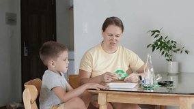 Mother and child making eco friendly activity. - Powered by Shutterstock - Get 15% off with code: PIKWIZARD15