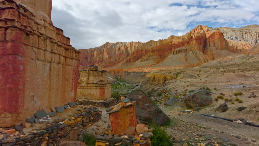 A serene Tibetan Chorten standing tall amidst the rugged beauty of Upper Mustang, Nepal