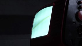 Old analog television set displaying static noise in dark room - Powered by Shutterstock - Get 15% off with code: PIKWIZARD15