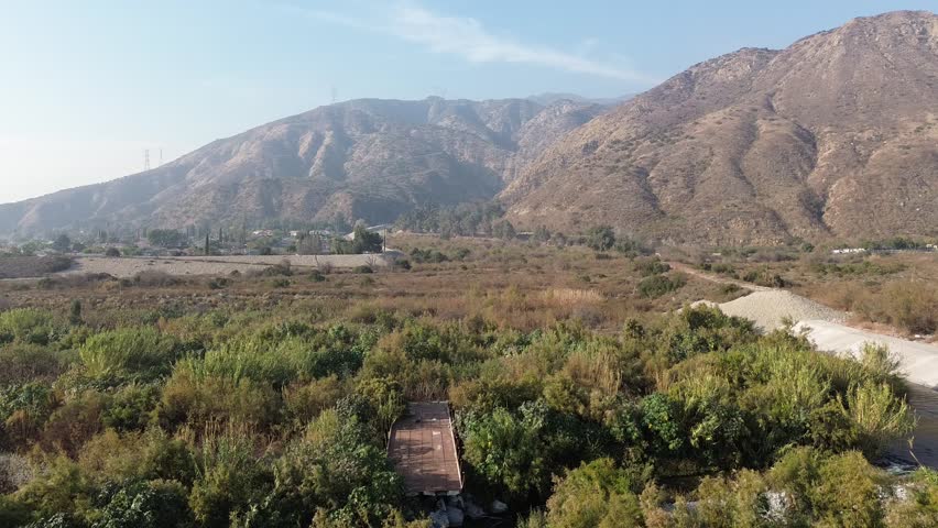 San Gabriel River at Azusa moving alongside mountains.