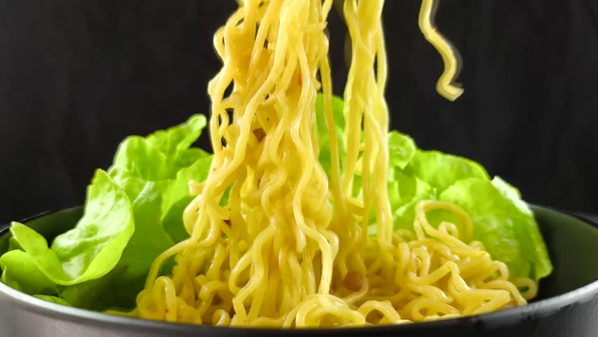 Keeping noodles by chopsticks, in door  Chiangmai  Thailand.