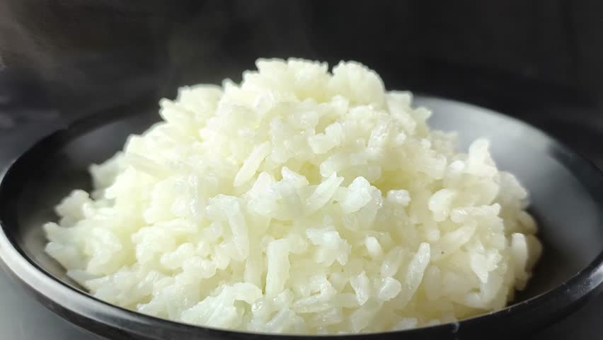 Cooked Jasmine rice in bowl, in door Chiangmai Thailand.