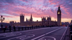Beautiful time lapse view of the Big Ben tower and Westminster Palace in London, England, during sunset with blurred street traffic - Powered by Shutterstock - Get 15% off with code: PIKWIZARD15