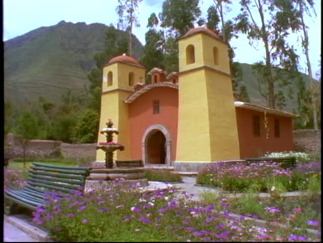 PERU, 1998 The Andes, small yellow Spanish church with twin bell towers