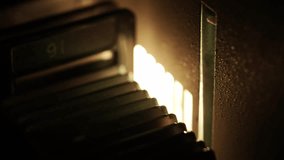 The slide changing mechanism in a 1970s projector. The operation of the mechanism causes the projector to vibrate. - Powered by Shutterstock - Get 15% off with code: PIKWIZARD15