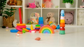 A child plays in a room with toys. Selective focus. - Powered by Shutterstock - Get 15% off with code: PIKWIZARD15