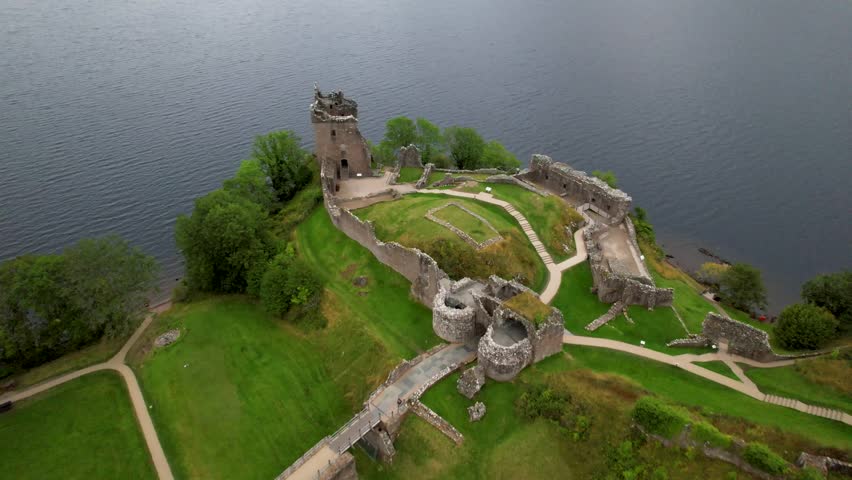 Looking down on Urquhart Castle Ruins on Loch Ness, Scotland- aerial