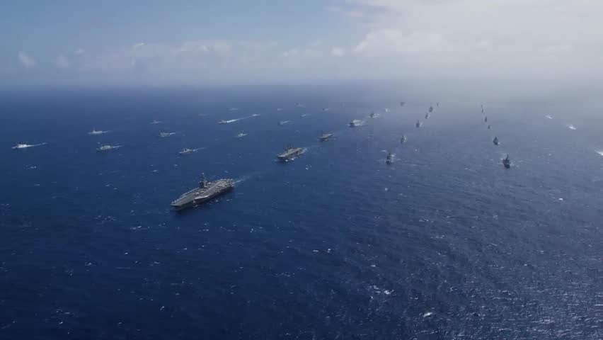 Forty ships and submarines representing 13 international partner nations sailed in tight formation