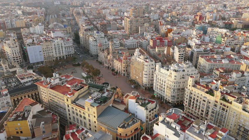 Beautiful Aerial drone view of Valencia historical city center and City Hall district highlights iconic landmarks, stunning and the majestic morning light over amazing city in Catalonia province.
