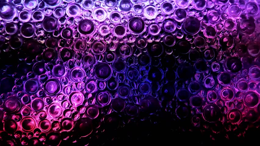 Textured Circles wall in purple, pink and black tones.Glass texture of circles with light shine .Zoom and distort wallpaper 