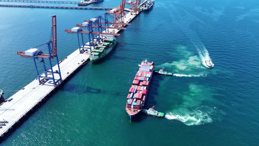 Tug boat pulling Cargo container ship go to international yard port. technology freight shipping with smart port.	