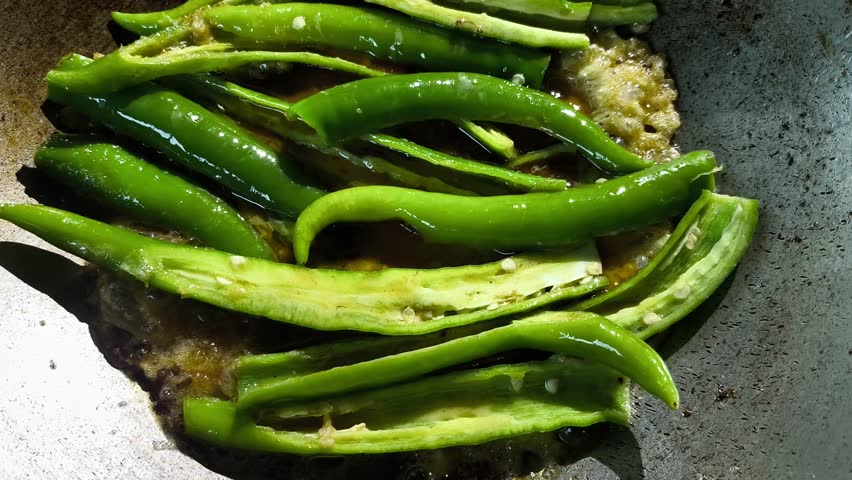 Frying hot pepper with omelet in pan, in door  Chiangmai  Thailand.