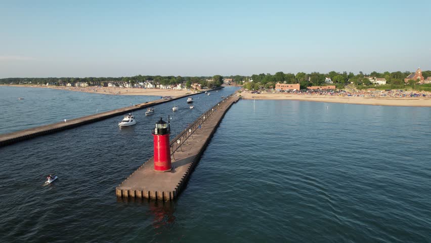 Aerial view of the light house of south haven beach with boats in lake michigan