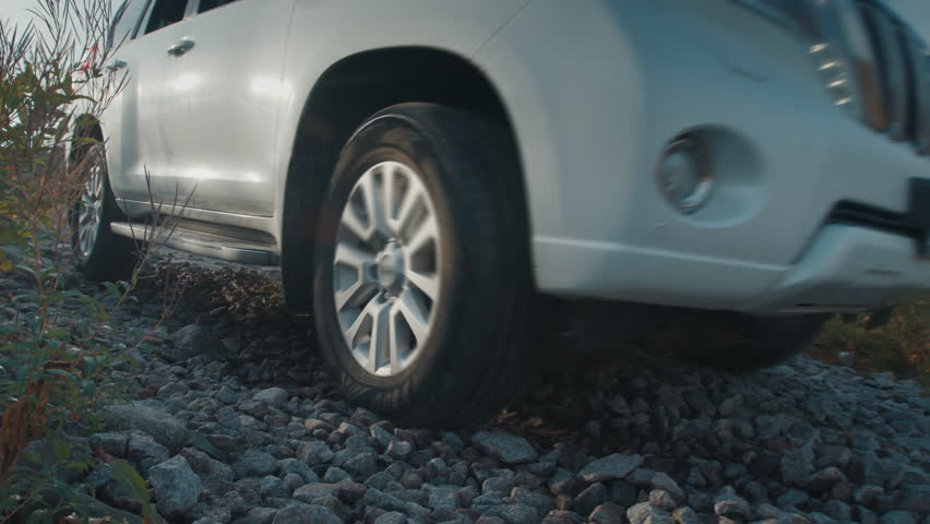 4x4 car moves on the gravel road