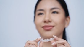 Video of close-up of woman wearing orthodontic silicone trainer. Invisible braces aligner. - Powered by Shutterstock - Get 15% off with code: PIKWIZARD15