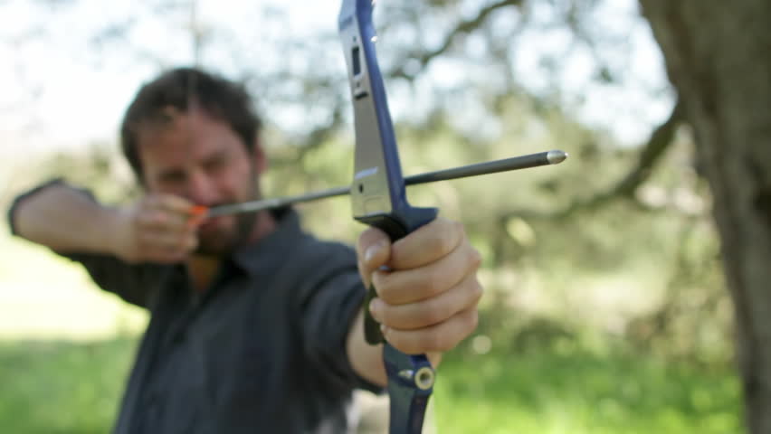 Archer viewed from the front with focus on the arrow tip and front of the bow.