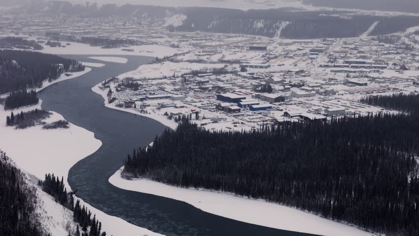 Snow-Covered City Capital Of Whitehorse During Winter In Yukon Territory, Northern Canada. Aerial Shot