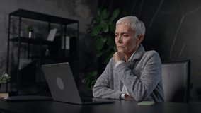 Senior Woman Thinking While Using Laptop - Powered by Shutterstock - Get 15% off with code: PIKWIZARD15