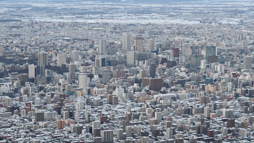4K Day to night view of cityscape Sapporo downtown in winter
