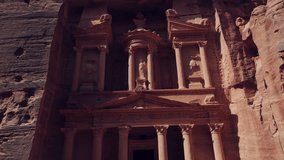 The Treasury (Al-Khazneh) ancient tomb rock cut sculpture facade architecture, Petra, Aerial ascending - Powered by Shutterstock - Get 15% off with code: PIKWIZARD15