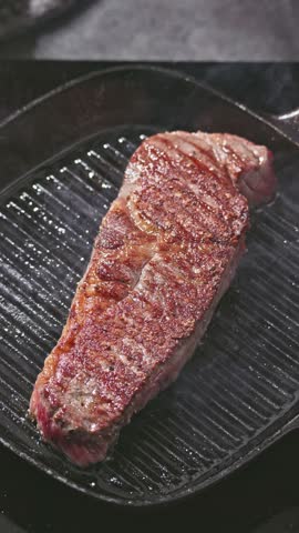 delicious juicy wagyu beef steak meat cooking on a grill pan. Process of making perfect steak at home