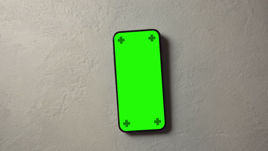 A sleek, modern smartphone with a green-screen placeholder on a Plaster Texture, viewed from above as a camera crane moves slowly in a cinematic manner. Perfect for app, website, or interface mockup