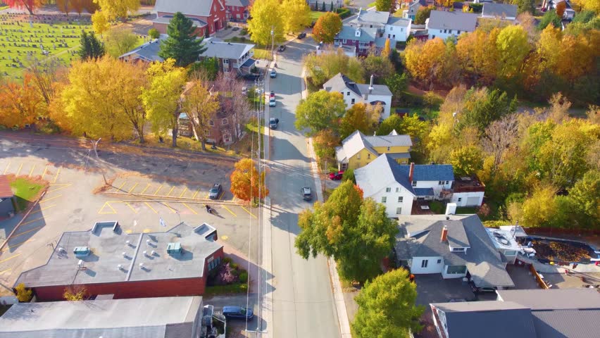 Nice building town in an unknown region located in Estrie, Canada, with lovely houses with green spaces and surrounded by trees