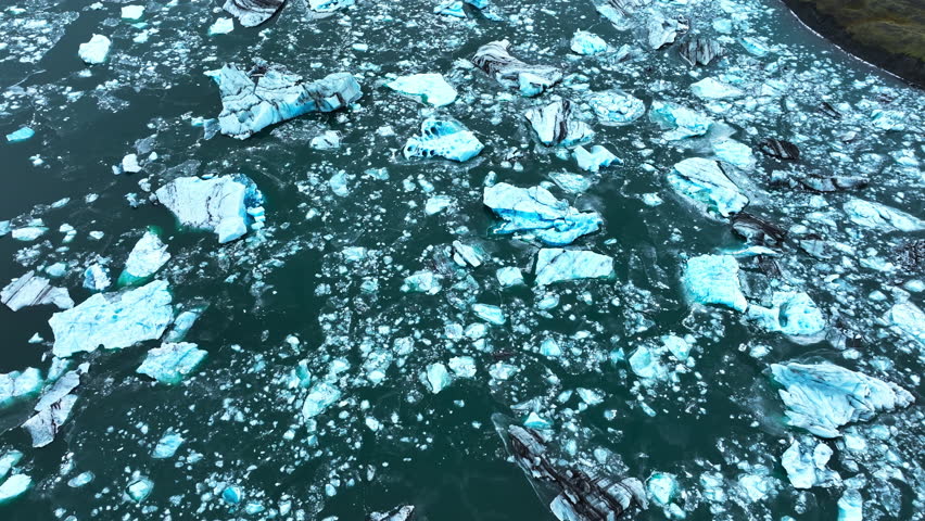 Icebergs Huge Chunks of Blue Glacier Ice Floating Arctic Nature in Iceland Ocean Aerial View