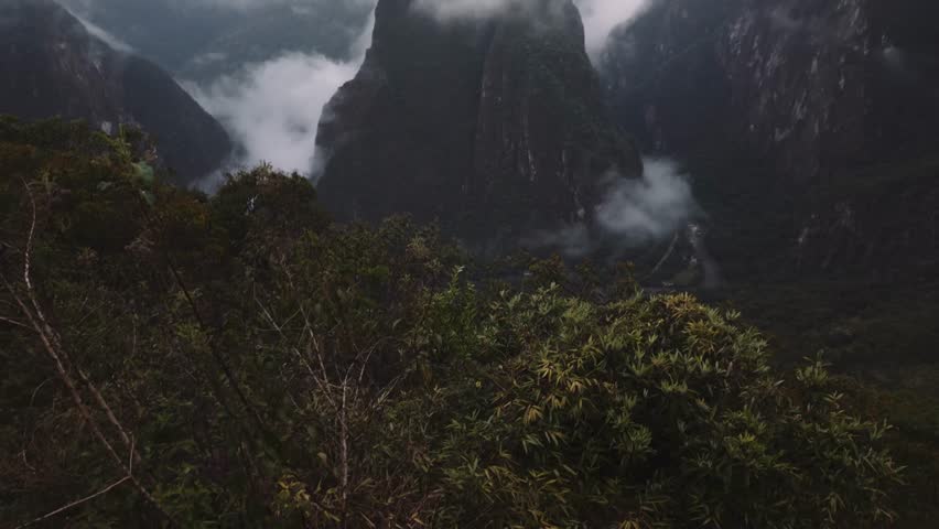 Low Clouds Over Machu Picchu Majestic Mountains In Peru. Aerial Drone Shot