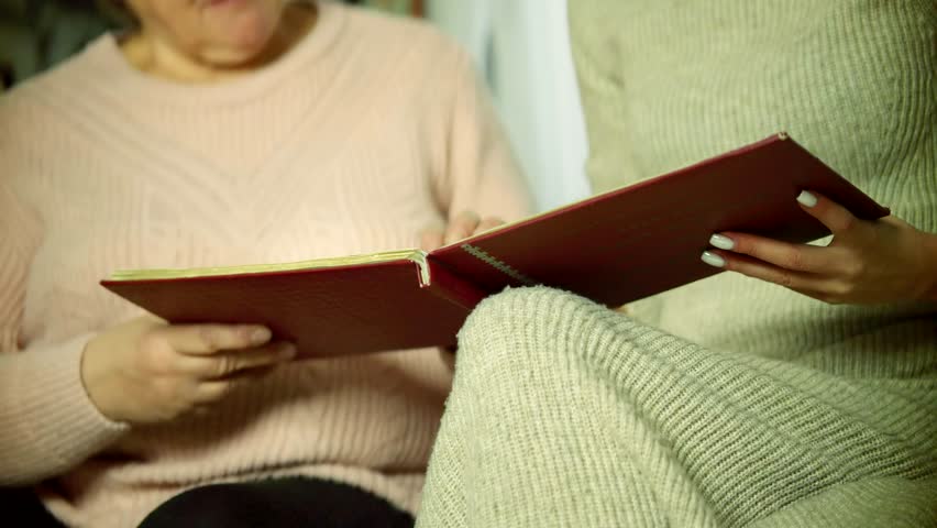 Family Album Photo. Home Vintage Photos Album Photobook Past Event. Woman Having Fun Looking Life Memories Old Photo Album Nostalgic Memory At Elderly Time. Family Entertainment Recalls Past Biography