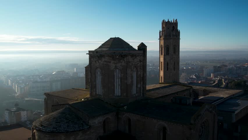 Majestic old cathedral on top of the hill and sorrounded by the city of Lleida in Catalonia, Spain. High quality 4k drone footage