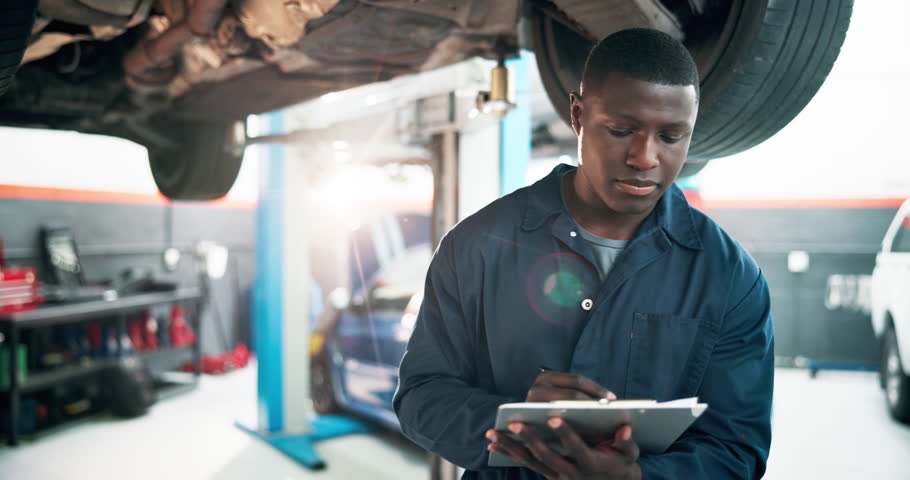 Mechanic, car and black man with clipboard, inspection and calibration with vehicle maintenance. African person, employee and motor technician with diagnostic test, transport and checklist in garage