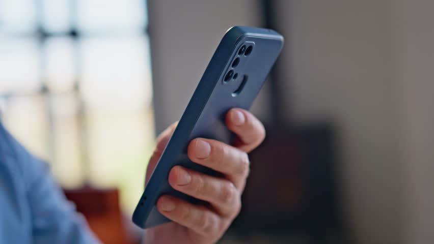 Businessman hands scrolling smartphone at light building interior closeup. Serious man executive in shirt browsing cellphone email at modern office. Thoughtful guy analyzing information mobile phone - Powered by Shutterstock - Get 15% off with code: PIKWIZARD15