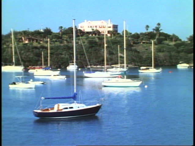 Pretty East End bay with houses on hill and boats in water, Bermuda