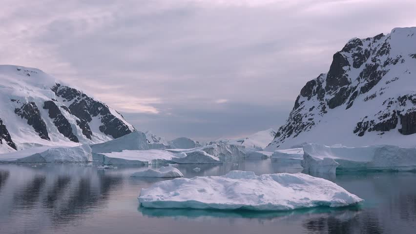 Explore the effects of global warming on icebergs in the Antarctic and Greenland. Discover the shrinking ice formations and changing landscapes in these remote locations.