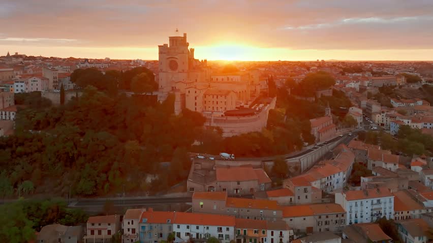 Magnificent Cathedral of Saint Nazaire in Beziers at sunrise, Southern France. Aerial view of the Beziers old town in France.