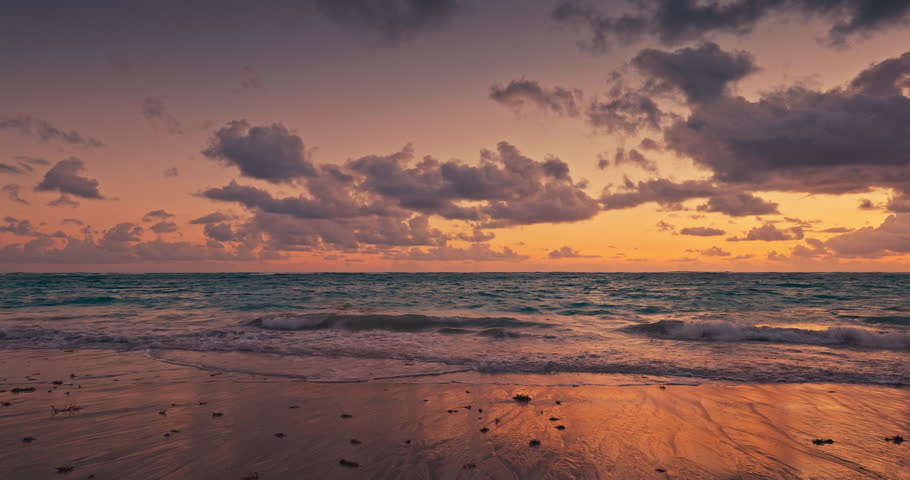 Tropical ocean sunrise, scenic color sunset over caribbean sea shore and sandy island beach Dominican Republic Punta Cana