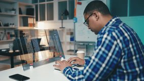 African American programmer works on a futuristic computer screen, crafting code - Powered by Shutterstock - Get 15% off with code: PIKWIZARD15