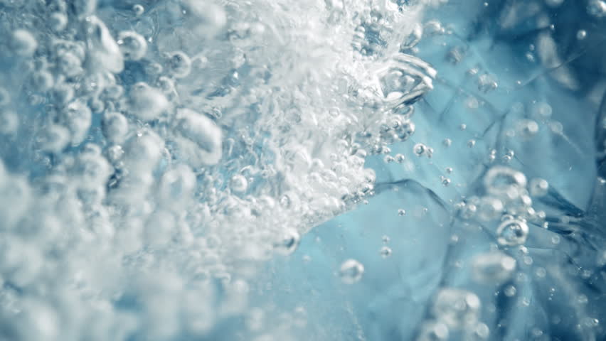 Super Slow Motion Shot of Ice and Air Bubbles in Crystal Clear Water at 1000fps.