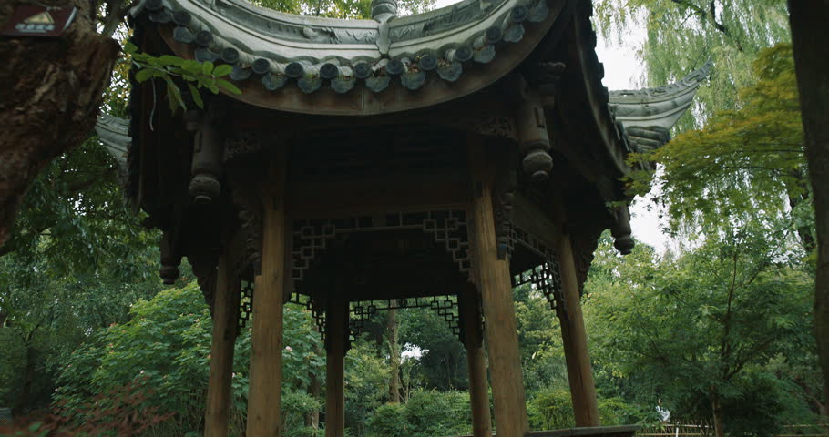 Chengdu, Sichuan, China. Garden Area Of Wuhou Memorial Temple. Elegant Ornamental Gazebo. Green Foliage Bushes And Calm Pond. Comfortable Environment To Embrace Nature. Silence And Peace. Zen-like
