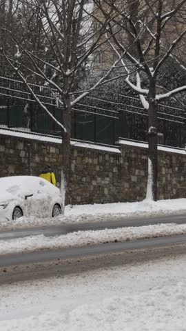 Person Walking Down the DC Street in the Snow