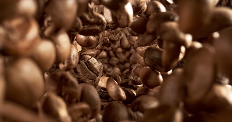 Close up of seeds of coffee. Fragrant coffee beans Super Macro Close Up. Shot on super slow motion camera 1000 fps.