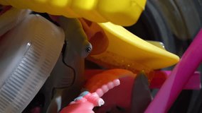 Top down view of plastic toys pulverized in a blender, symbolizing waste and pollution - Powered by Shutterstock - Get 15% off with code: PIKWIZARD15