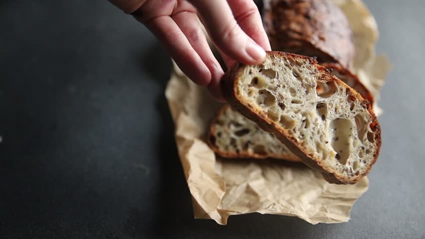 Grain bread sunflower, chia, flax seed, cut oats fresh tasty food dish delicious gourmet food background on the table rustic food top view copy space vegetarian and vegan food
