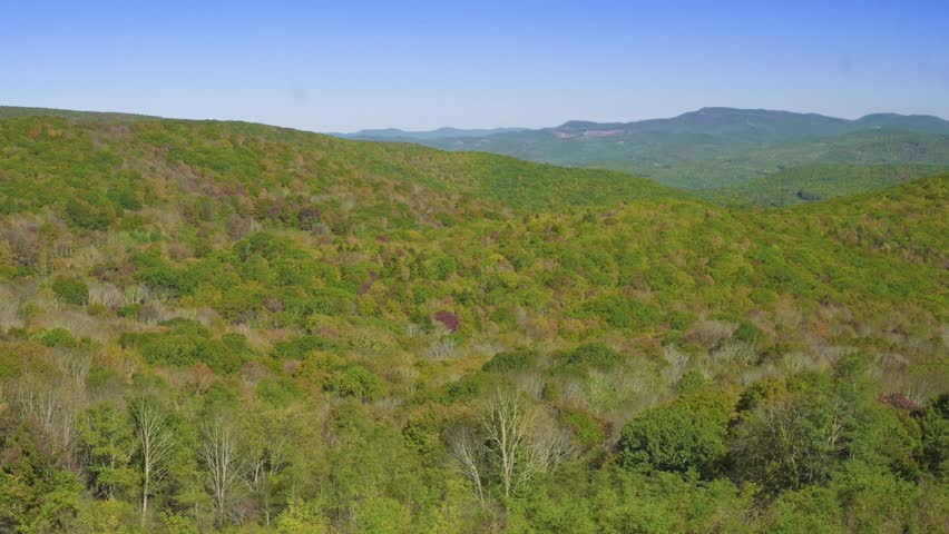 Rolling Hills and Forests on AppalachianTrail picturesque view of green rolling hills dense forests under clear blue sky along Appalachian Trail, USA nature, hiking, and outdoor exploration themes.