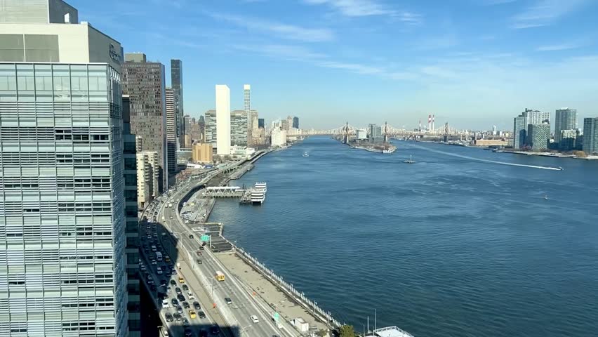 Time lapse of East river in New York City with UN building in the background