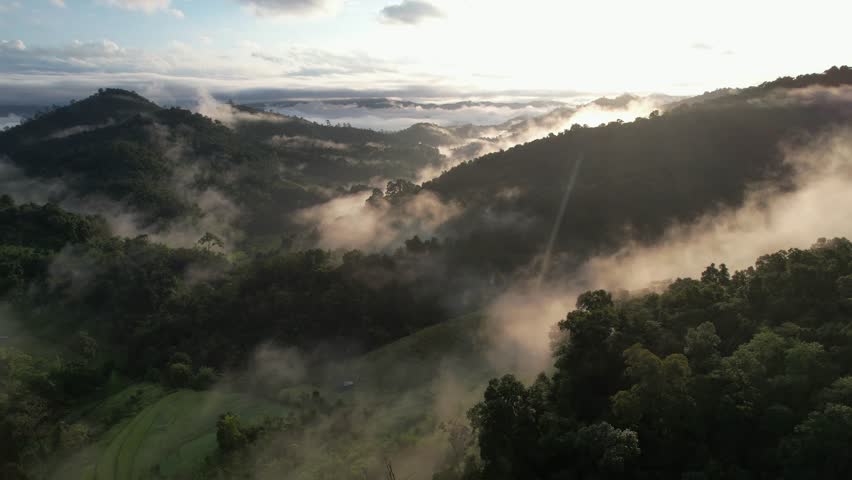 Aerial landscape view of mountains and fog in the morning by drone