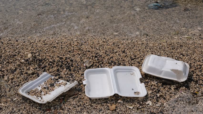 Garbage trash styrofoam being washed to the shore in Manila Bay, Philippines. 4K footage