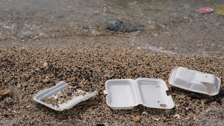 Garbage trash styrofoam being washed to the shore in Manila Bay, Philippines. 4K footage
